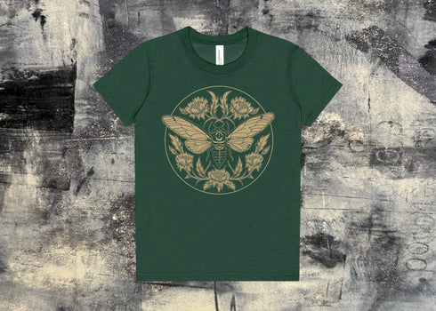 A green kids t-shirt with an illustration of a cicada with florals printed in a gold toned tan ink. 