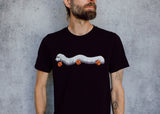 A model wearing a black t-shirt with a hand drawn illustration of a millipede in a ghost costume carrying jack'o lantern candy pails. 